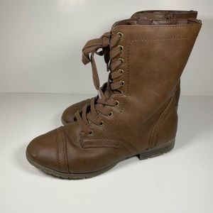 Woman’s brown combat boots
